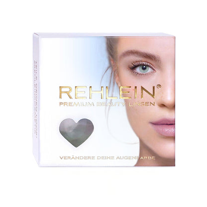 Rehlein Premium Beauty Linsen in der Farbe Haselnuss – Farbige Kontaktlinsen, Monatslinsen für den täglichen Gebrauch, Vorderseite der Produktverpackung mit goldenem Schriftzug und Frauengesicht, Aufdruck: "verändere Deine Augenfarbe"